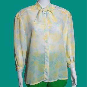 Vintage Floral Shear Button Up Blouse. Top has a ribbon that forms a bow